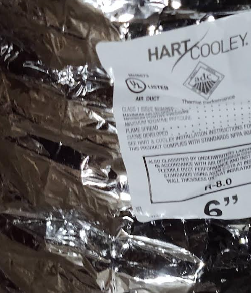 Close-up of UL 181–listed flexible air duct label (Hart & Cooley 6-inch). Manufacturer and UL certification visible on the foil jacket, confirming code-compliant material per IRC M1506.1