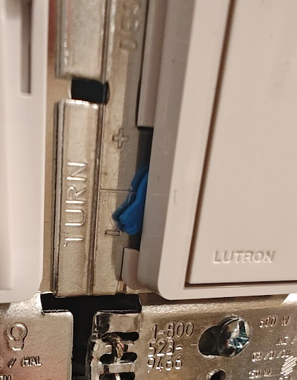 Close-up of Lutron Diva dimmer showing low-end trim adjustment dial for setting minimum dim level