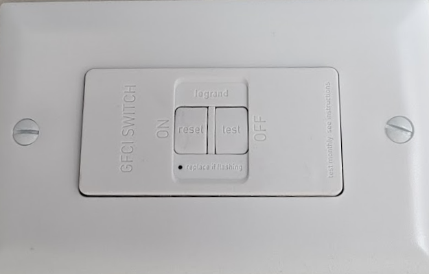 Faceless GFCI protection device installed in wall plate for hardwired appliance safety
