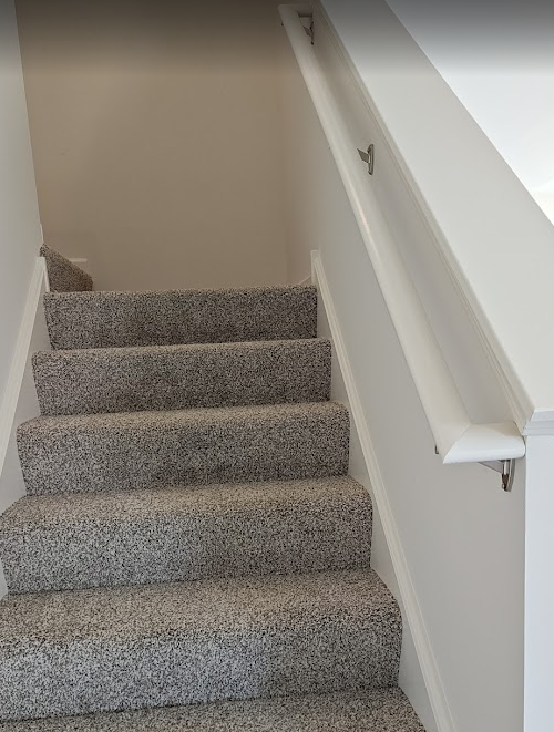interior stair handrail continuity IRC example continuous wall-mounted handrail