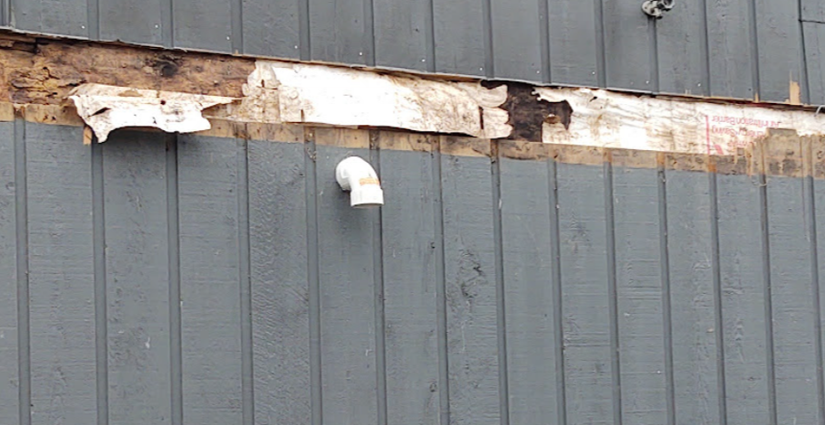 rotted band joist caused by missing deck ledger flashing water intrusion