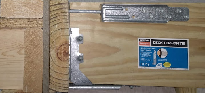deck lateral load connection hardware showing Simpson DTT1Z tension tie installation