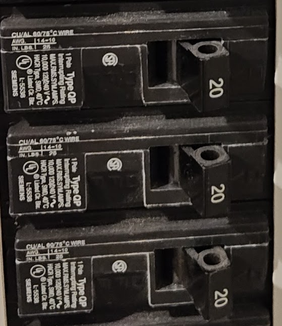 Breaker terminal marking showing CU/AL 60/75°C wire rating for conductor ampacity and termination limits