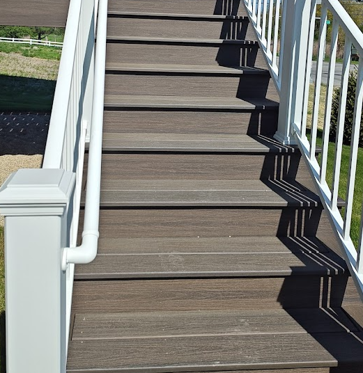 residential deck stairs showing consistent riser height and tread depth for IRC stair inspection compliance