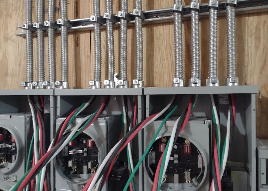 Flexible metal conduit installation with listed fittings and grounding continuity path example
