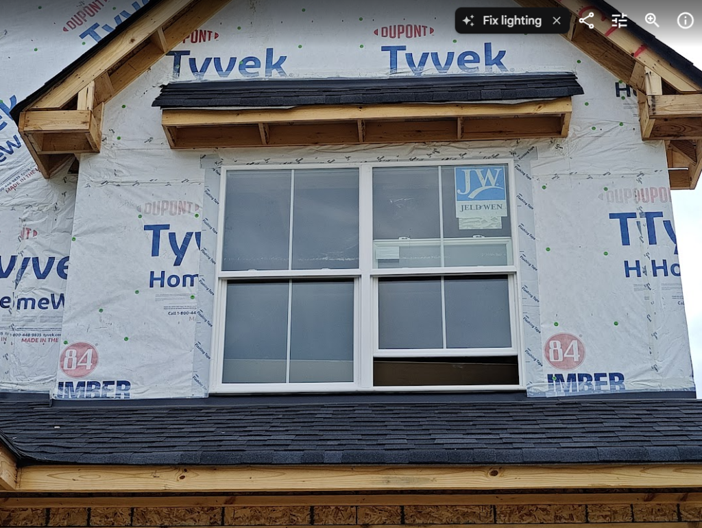 Double-hung bedroom egress window requirements showing the limited net clear opening available when the lower sash is raised.
