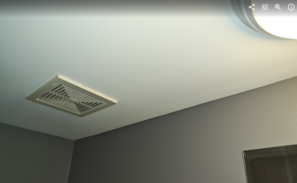 Bathroom exhaust fan installed near a shower where manufacturer installation instructions may require GFCI protection under NEC 110.3(B).