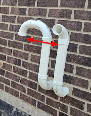 Direct vent furnace intake and exhaust pipe separation at exterior wall