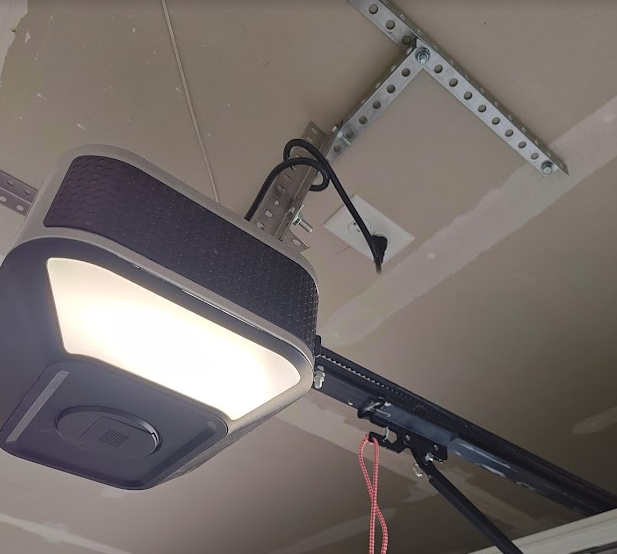 Garage door opener ceiling receptacle under NEC 2020 and 2023 requirements
